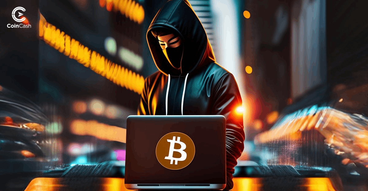 Egy hacker áll a Bitcoin logós laptopja mögött, ami a Bitcoin hálózatát szemlélteti