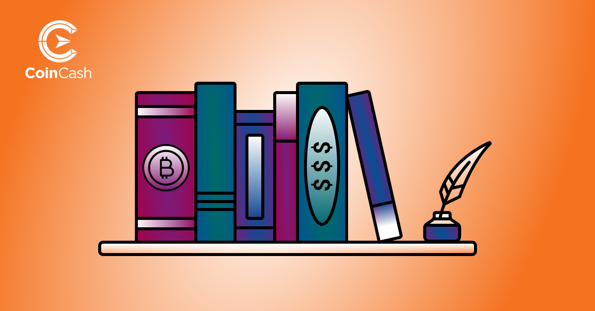 Bitcoin jellel, valamint dollár jellel ellátott könyvek sorakoznak egymás mellett egy polcon, a polc szélén egy tollal